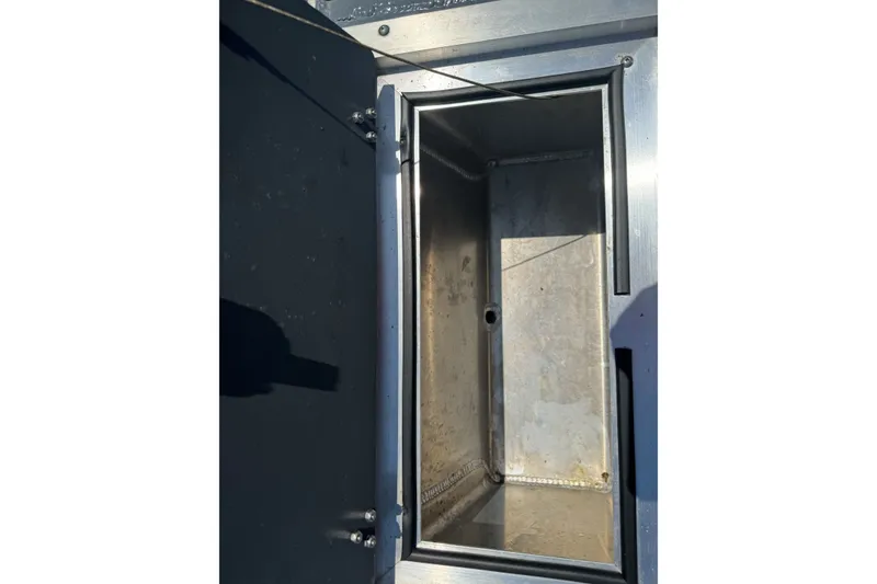 Slide: The Image of Open storage compartment in 2021 Hewescraft 180 River Runner boat. - 20