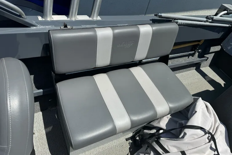 Slide: The Image of Gray and white seating in a 2021 Hewescraft 180 River Runner boat. - 15