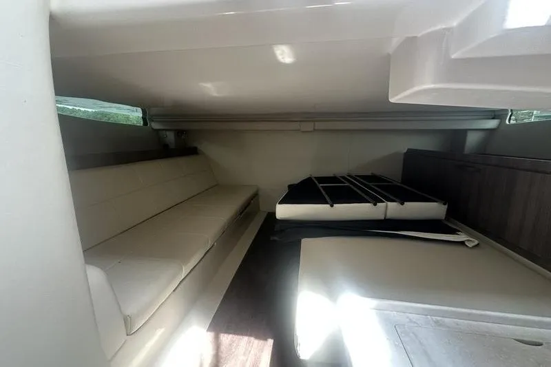 Slide: The Image of 2021 Regal 38 SAV cabin interior with seating and storage area. - 30