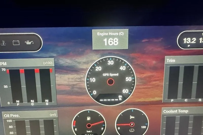 Slide: The Image of Dashboard of a 2021 Regal 38 SAV showing engine hours, GPS speed, and gauges. - 12
