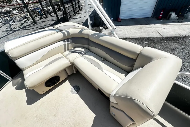 Slide: The Image of Beige seating on 2015 Godfrey 2286 Sweetwater Pontoon, docked at marina. - 9