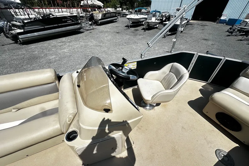 Slide: The Image of 2015 Godfrey 2286 Sweetwater Pontoon boat interior with steering console and seating. - 6