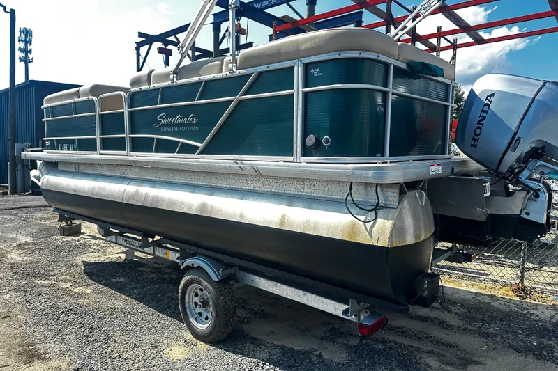 Slide: The Image of 2015 Godfrey 2286 Sweetwater Pontoon with Honda engine on trailer. - 3