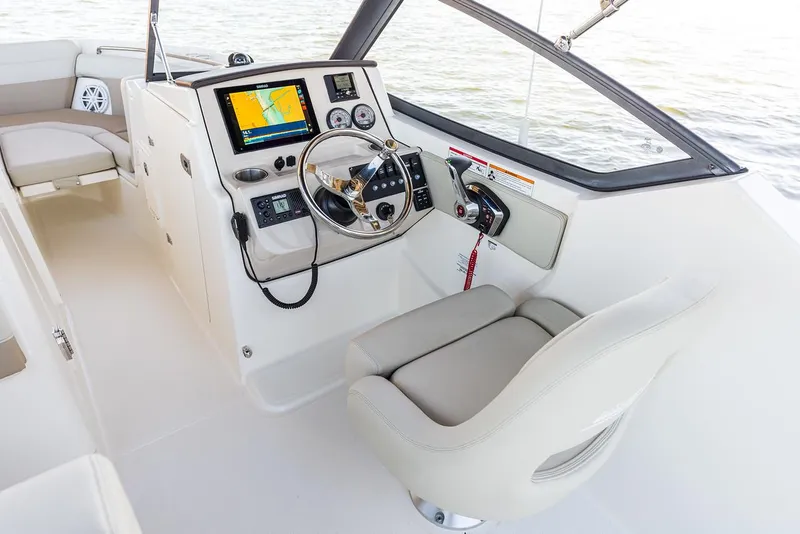 Slide: The Image of Manufacturer Provided Image: 2026 Boston Whaler 210 Vantage boat cockpit with modern navigation system and steering wheel. - 10