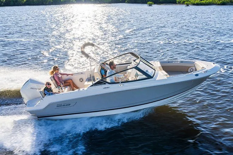 Slide: The Image of Manufacturer Provided Image: 2026 Boston Whaler 210 Vantage cruising on a sunny lake with passengers enjoying the ride. - 5