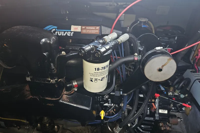 Slide: The Image of Engine compartment of a 1996 Sea Ray 370 Express Cruiser with visible components and wiring. - 37