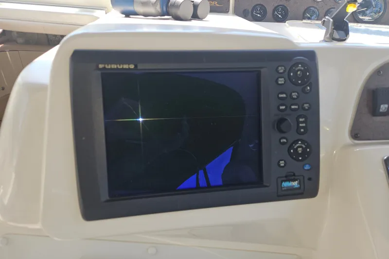 Slide: The Image of Furuno marine navigation system on 1996 Sea Ray 370 Express Cruiser dashboard. - 28
