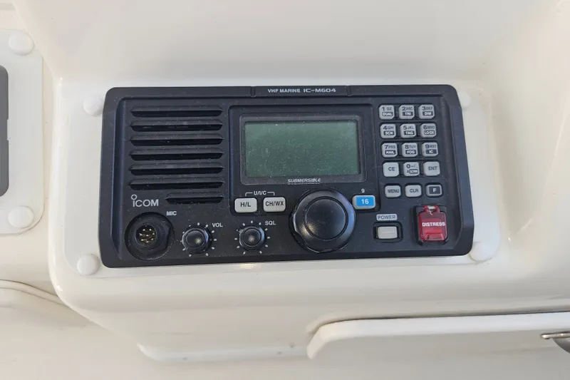 Slide: The Image of ICOM VHF marine radio on 1996 Sea Ray 370 Express Cruiser dashboard. - 30