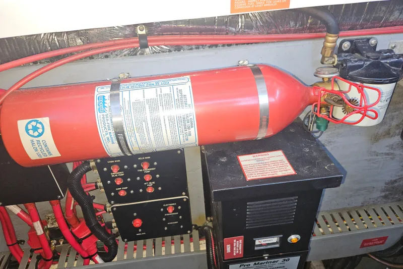 Slide: The Image of Engine room of 1996 Sea Ray 370 Express Cruiser with fire suppression system. - 33