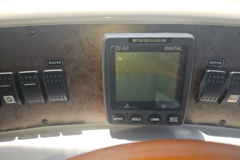 Slide: The Image of Control panel of a 1996 Sea Ray 370 Express Cruiser with Furuno digital display. - 31