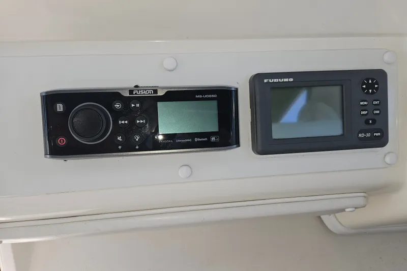 Slide: The Image of Fusion and Furuno marine electronics on 1996 Sea Ray 370 Express Cruiser dashboard. - 32