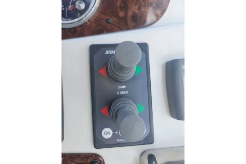 Slide: The Image of Control panel of a 2005 Meridian 368 Motoryacht with bow and stern thruster joysticks. - 45