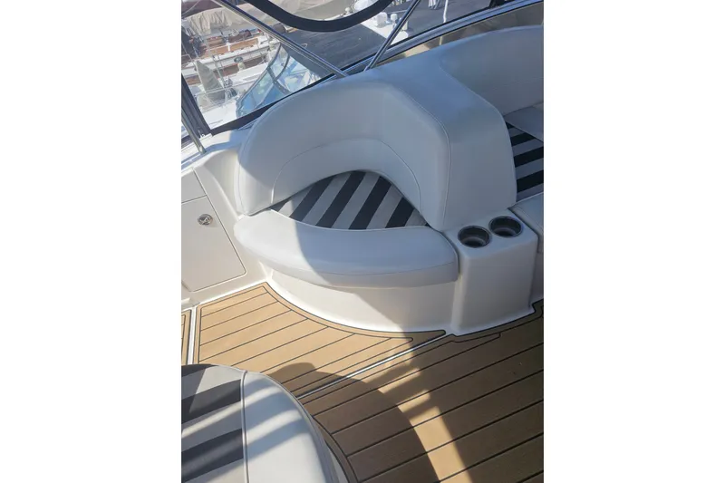 Slide: The Image of Interior seating of 2005 Meridian 368 Motoryacht with striped cushions and cup holders. - 16
