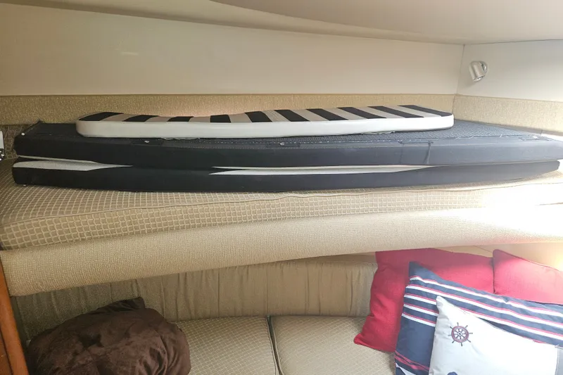 Slide: The Image of Interior of 2005 Meridian 368 Motoryacht with cushions and nautical-themed pillows. - 38