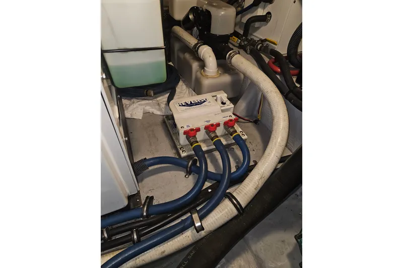 Slide: The Image of Engine room of 2005 Meridian 368 Motoryacht with hoses and mechanical components. - 70