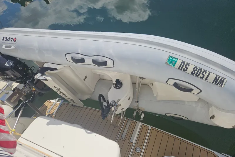 Slide: The Image of Inflatable boat with motor on 2005 Meridian 368 Motoryacht deck. - 62