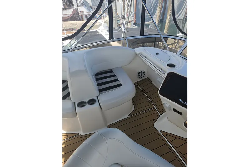 Slide: The Image of 2005 Meridian 368 Motoryacht interior with plush seating and modern navigation equipment. - 13