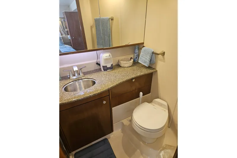 Slide: The Image of Bathroom interior of 2005 Meridian 368 Motoryacht with sink, toilet, and mirror. - 33