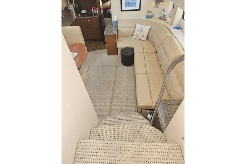 Slide: The Image of Interior of 2005 Meridian 368 Motoryacht with beige seating and carpeted stairs. - 17