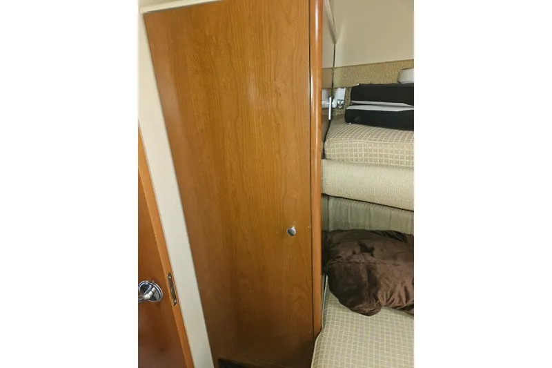 Slide: The Image of Interior of 2005 Meridian 368 Motoryacht with wooden cabinet and cozy bedding. - 28