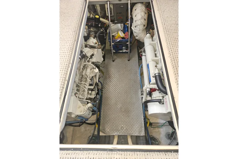 Slide: The Image of Engine room of 2005 Meridian 368 Motoryacht, showcasing mechanical components and equipment. - 65
