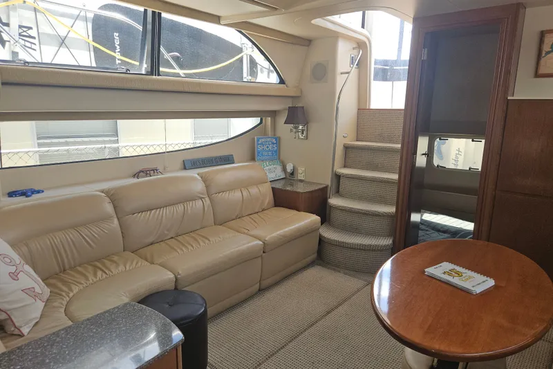Slide: The Image of Interior of 2005 Meridian 368 Motoryacht with beige leather seating and wooden table. - 18