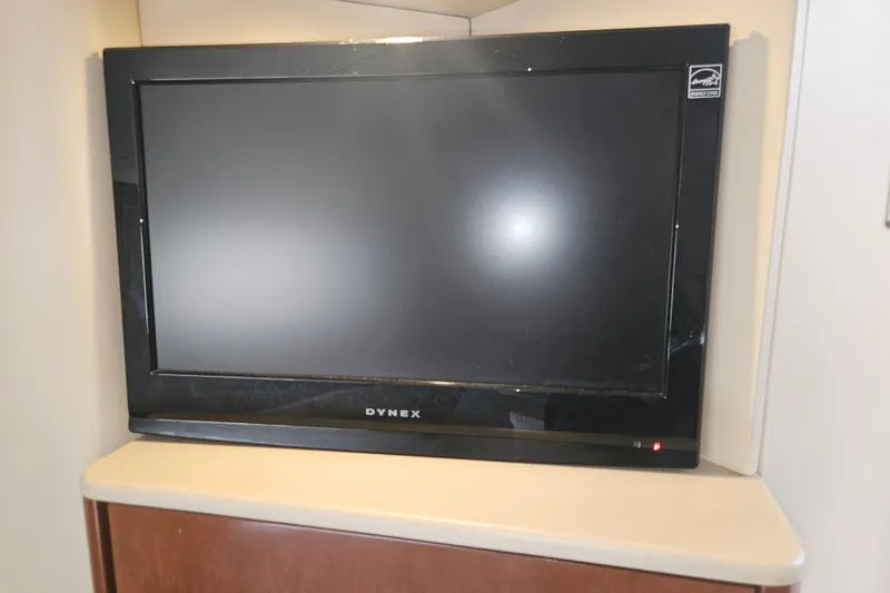 Slide: The Image of Dynex TV inside 2005 Meridian 368 Motoryacht, mounted on a wooden shelf. - 40