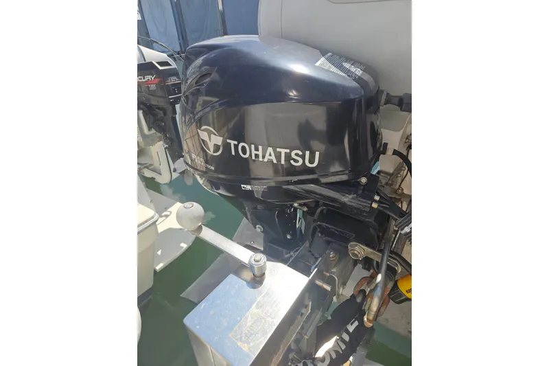 Slide: The Image of Tohatsu outboard motor on a 2005 Meridian 368 Motoryacht, docked in sunlight. - 63