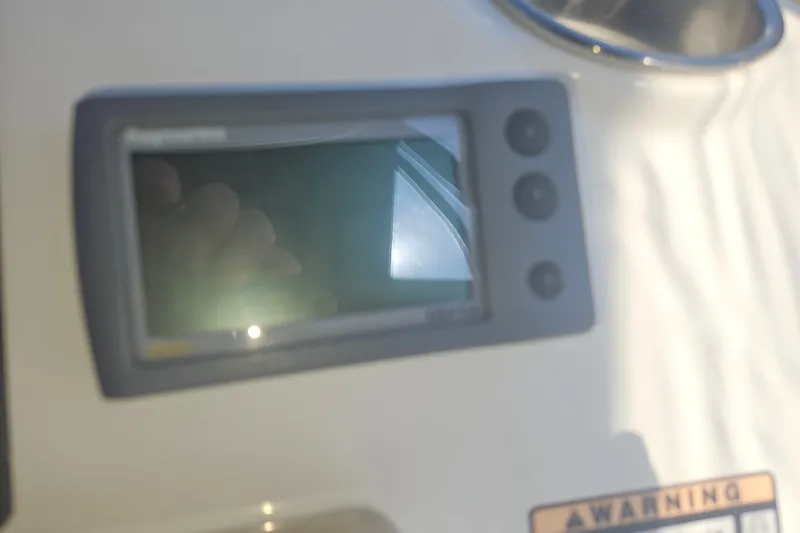 Slide: The Image of Control panel of a 2005 Meridian 368 Motoryacht with a digital display. - 48