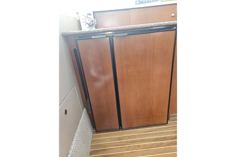 Slide: The Image of Wooden cabinet with countertop in 2005 Meridian 368 Motoryacht interior. - 25