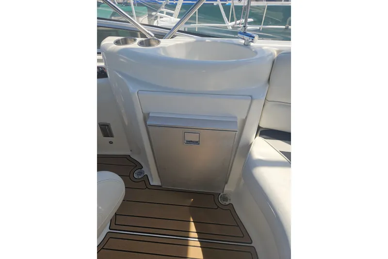 Slide: The Image of 2005 Meridian 368 Motoryacht interior with sink and built-in cooler on teak flooring. - 15