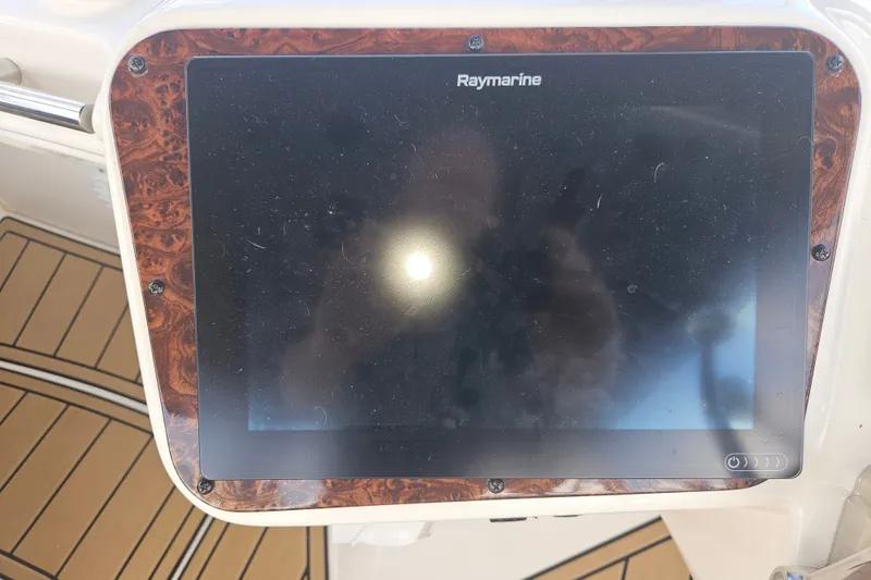 Slide: The Image of Raymarine display on 2005 Meridian 368 Motoryacht dashboard with wood trim. - 44