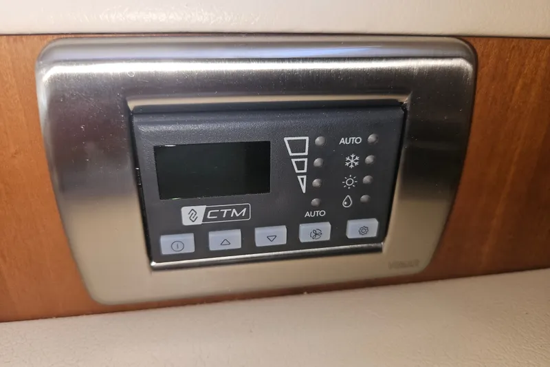 Slide: The Image of Control panel of a 2005 Meridian 368 Motoryacht, featuring CTM interface and buttons. - 50
