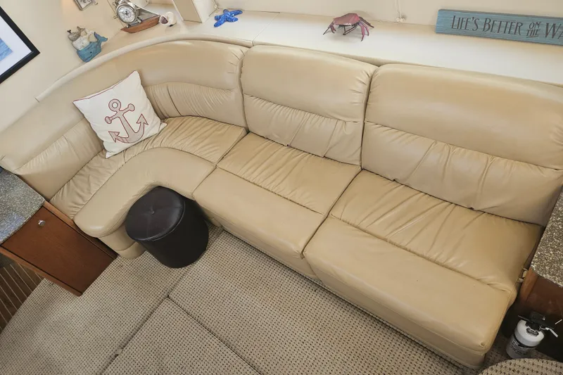 Slide: The Image of Luxurious beige leather seating in 2005 Meridian 368 Motoryacht interior, with nautical decor accents. - 19