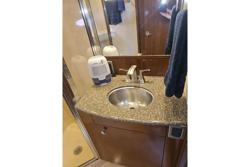Slide: The Image of Bathroom vanity in 2005 Meridian 368 Motoryacht with granite countertop and stainless steel sink. - 39