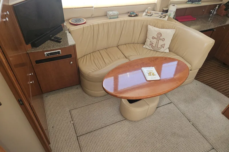 Slide: The Image of Luxurious interior of 2005 Meridian 368 Motoryacht with leather seating and wooden table. - 20