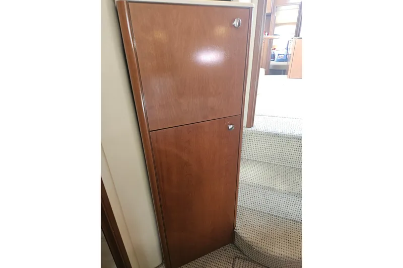 Slide: The Image of Wooden cabinet on 2005 Meridian 368 Motoryacht interior, near carpeted stairs. - 31