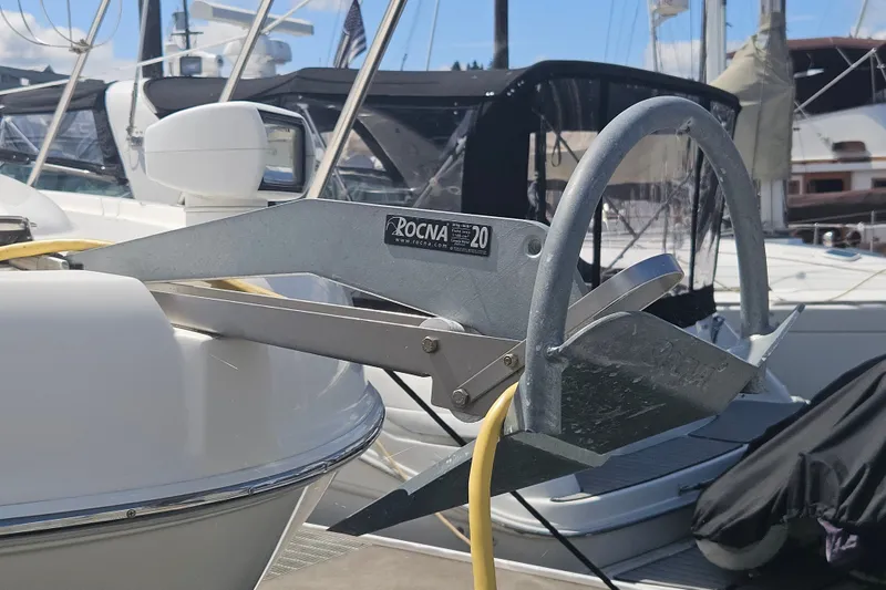 Slide: The Image of Rocna anchor on 2005 Meridian 368 Motoryacht, docked with other boats in background. - 60