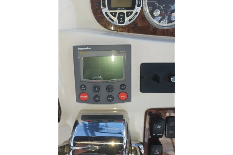Slide: The Image of Control panel of a 2005 Meridian 368 Motoryacht featuring Raymarine autopilot system. - 49