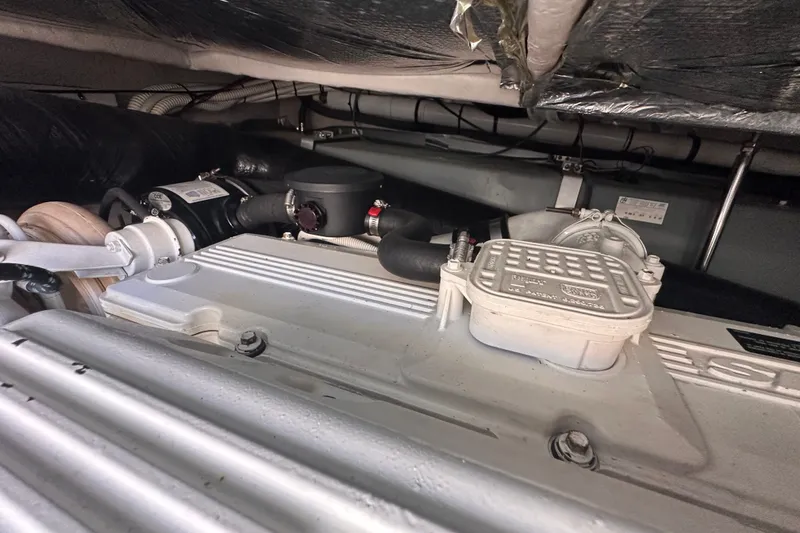 Slide: The Image of Engine compartment of a 2007 Sea Ray 48 Sundancer yacht, showcasing mechanical components. - 77