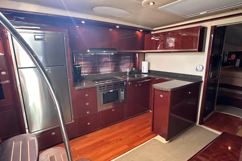 Slide: The Image of Luxurious kitchen interior of 2007 Sea Ray 48 Sundancer yacht with modern appliances. - 38