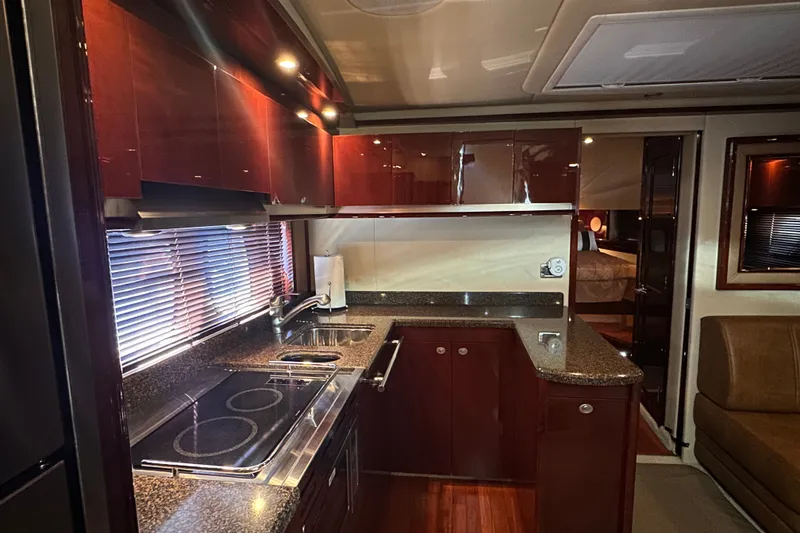Slide: The Image of Luxurious kitchen interior of 2007 Sea Ray 48 Sundancer yacht with modern amenities. - 41