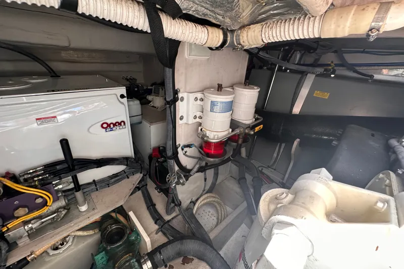 Slide: The Image of Engine room of 2007 Sea Ray 48 Sundancer with Onan generator and fuel filters. - 73