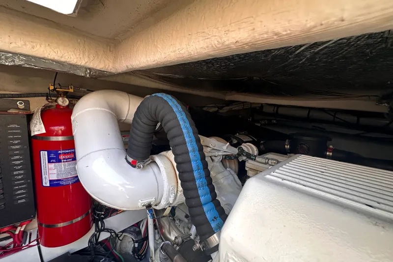Slide: The Image of Engine room of 2007 Sea Ray 48 Sundancer with fire extinguisher and ventilation system. - 79