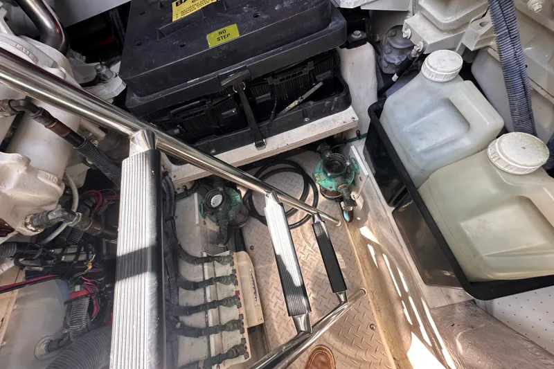Slide: The Image of Engine compartment of a 2007 Sea Ray 48 Sundancer with visible components and storage containers. - 86