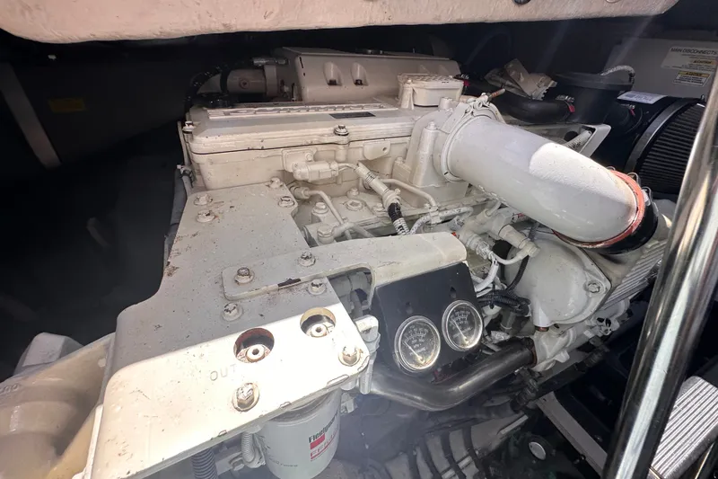 Slide: The Image of Engine compartment of a 2007 Sea Ray 48 Sundancer yacht, showcasing mechanical components. - 74