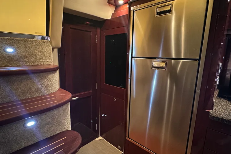 Slide: The Image of Interior of 2007 Sea Ray 48 Sundancer yacht with stainless steel fridge and carpeted stairs. - 45