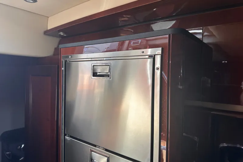 Slide: The Image of Stainless steel refrigerator in 2007 Sea Ray 48 Sundancer yacht interior. - 60