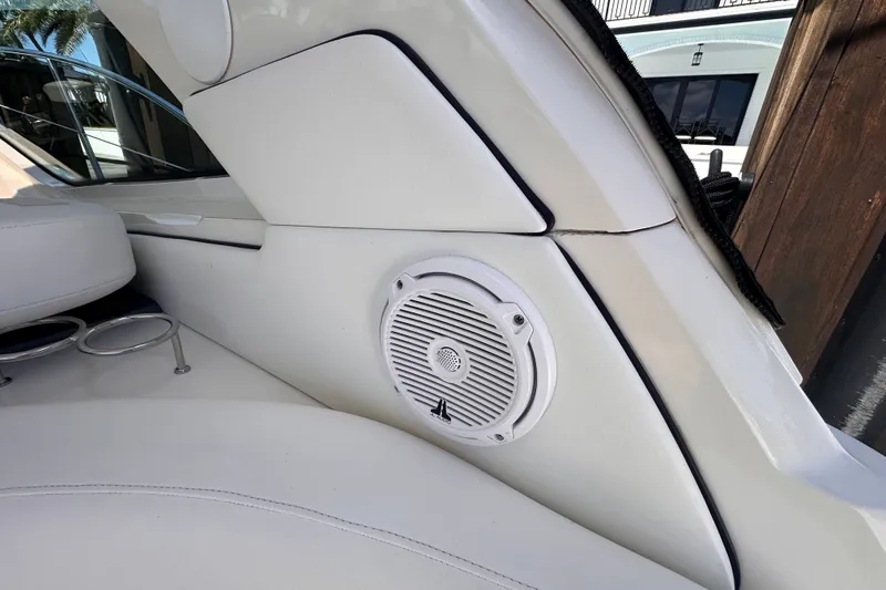 Slide: The Image of White interior of 2007 Sea Ray 48 Sundancer with speaker and cup holders. - 20