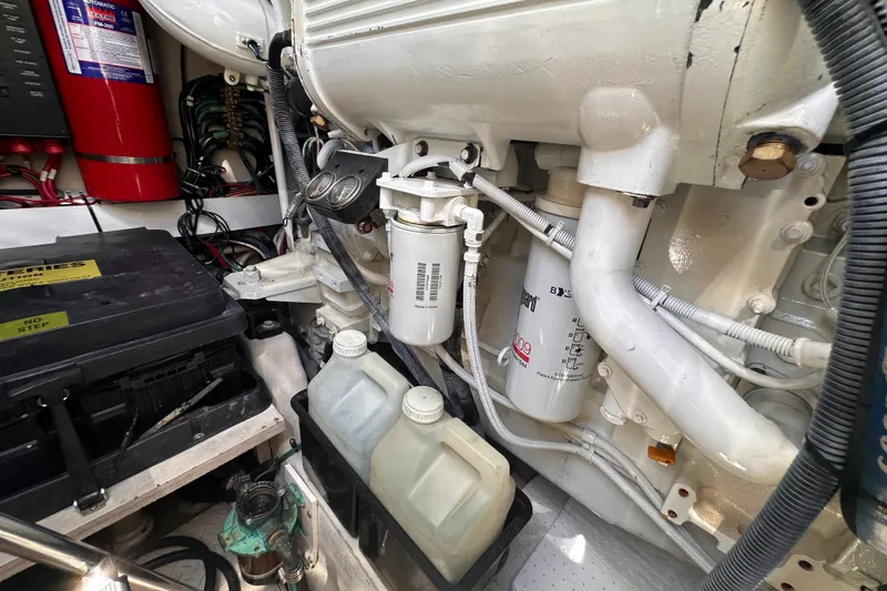Slide: The Image of Engine room of a 2007 Sea Ray 48 Sundancer with filters and components visible. - 85